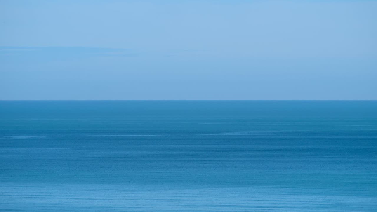 A quiet blue ocean horizon